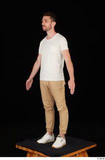  Trent brown trousers casual dressed standing white sneakers white t shirt whole body 0002.jpg